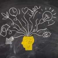 chalkboard-drawing-head-idea-concept-designs_23-2148342861