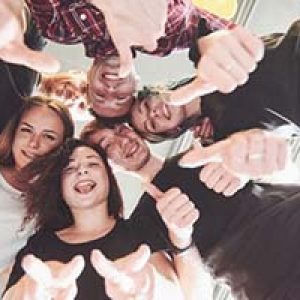 happy-group-friends-with-their-hands-together-middle_146671-15292