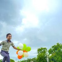 little-indian-school-boy-jumping-sky-with-tri-color-balloons-celebrating-independence-republic-day-india_54391-2254