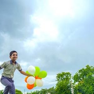little-indian-school-boy-jumping-sky-with-tri-color-balloons-celebrating-independence-republic-day-india_54391-2254