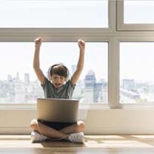 young-boy-playing-laptop_23-2148492903